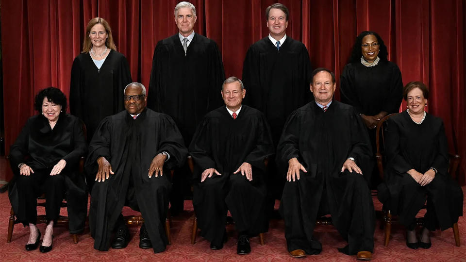 Supreme Court Justices sitting for a portrait.