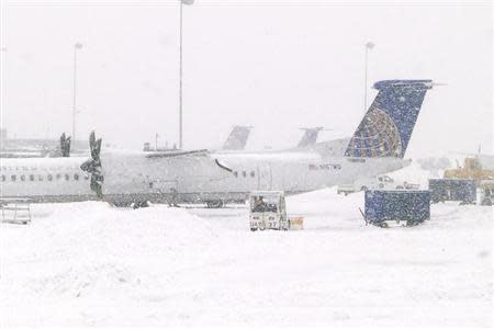 A view of airplanes on a tarmac during a snowstorm at the Washington International Dulles airport in Dulles, Virginia March 3, 2014. REUTERS/Yuri Gripas