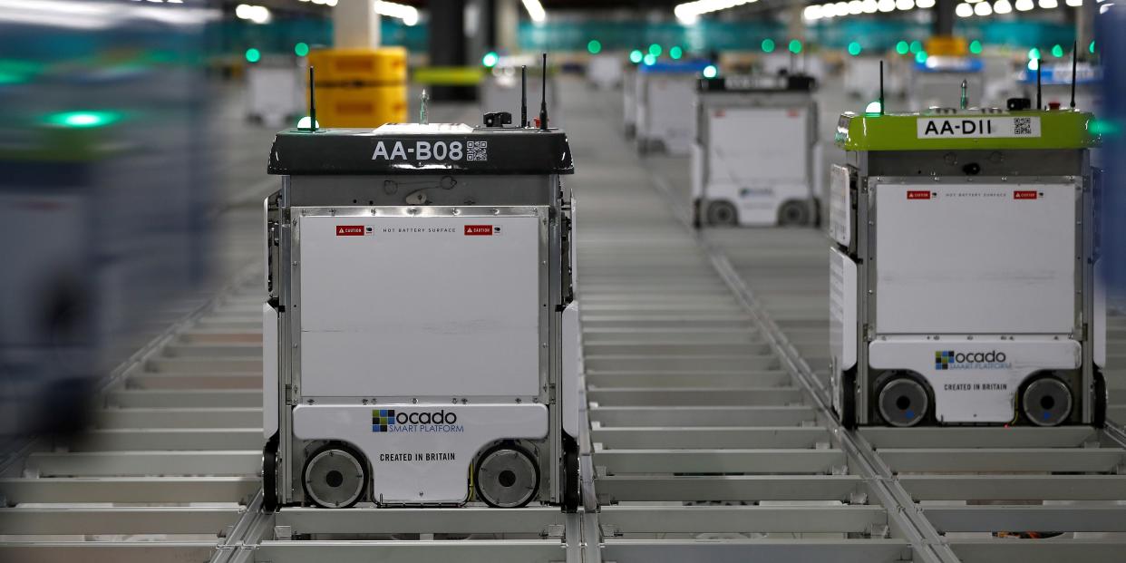 FILE PHOTO: "Bots" are seen on the grid of the "smart platform" at Ocado in Andover, Britain May 1, 2018. REUTERS/Peter Nicholls/File Photo