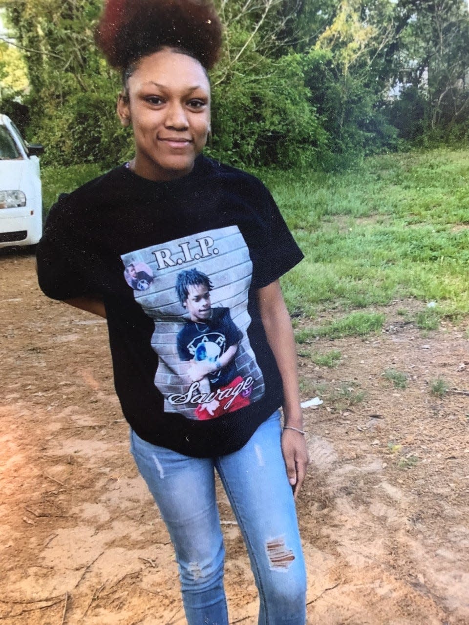 Skyteria Poston is seen wearing a shirt remembering her brother who was shot and killed in Shelby years earlier.
