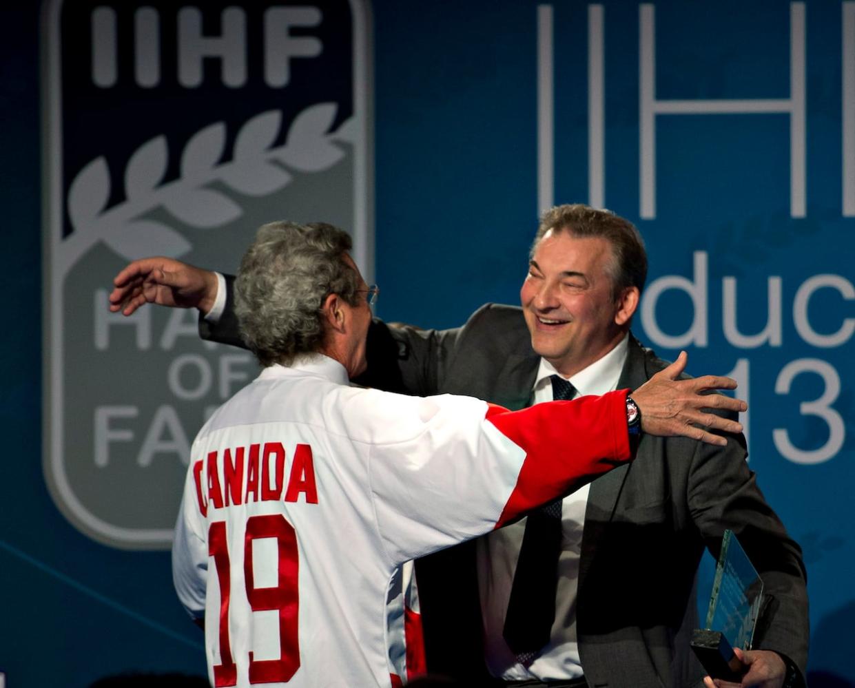 1972 Team Canada's Paul Henderson is greeted by 1972 Soviet team goalkeeper Vladislav Tretiak as he is inducted at the IIHF Hall of Fame at the world hockey championship in Stockholm, Sweden on Sunday, May 19, 2013. (Jacques Boissinot/The Canadian Press - image credit)