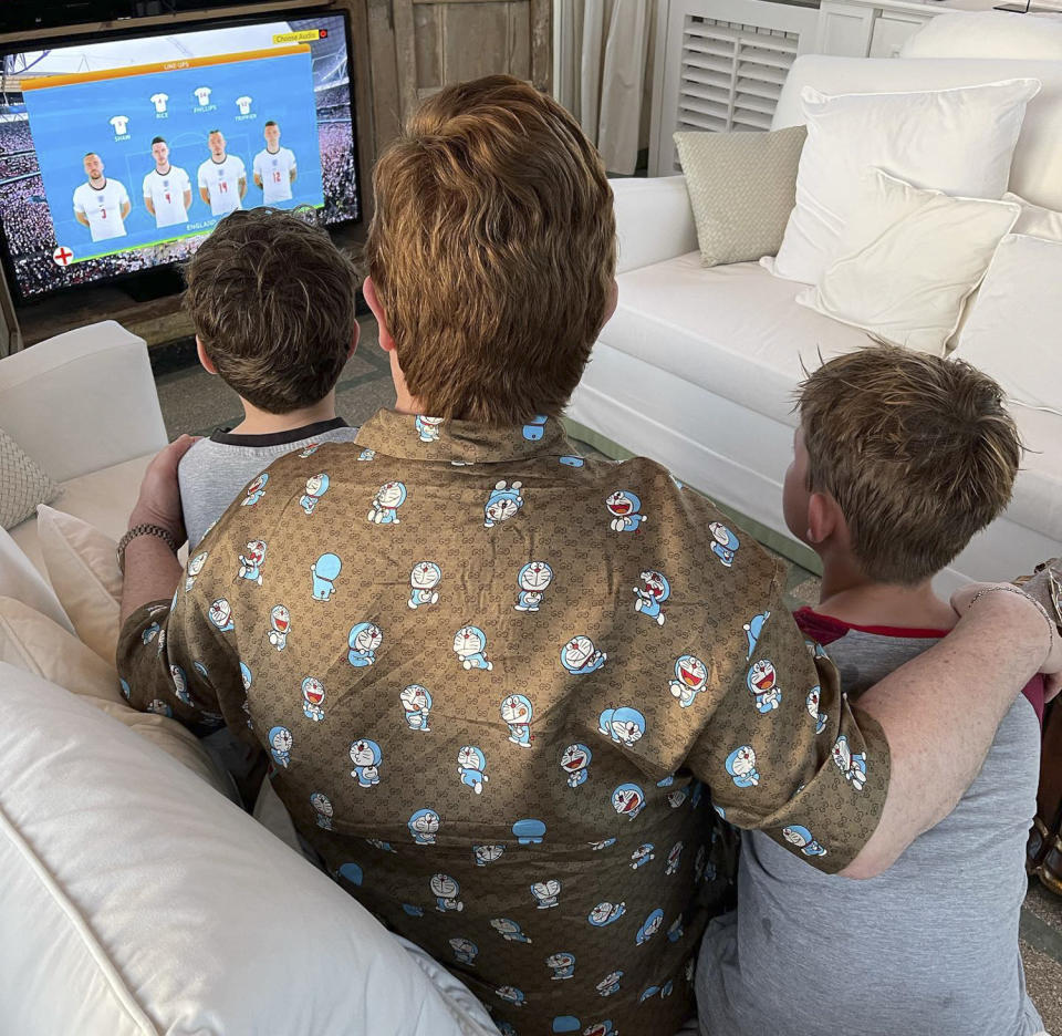 Elton John Watching a Soccer Game With His Sons