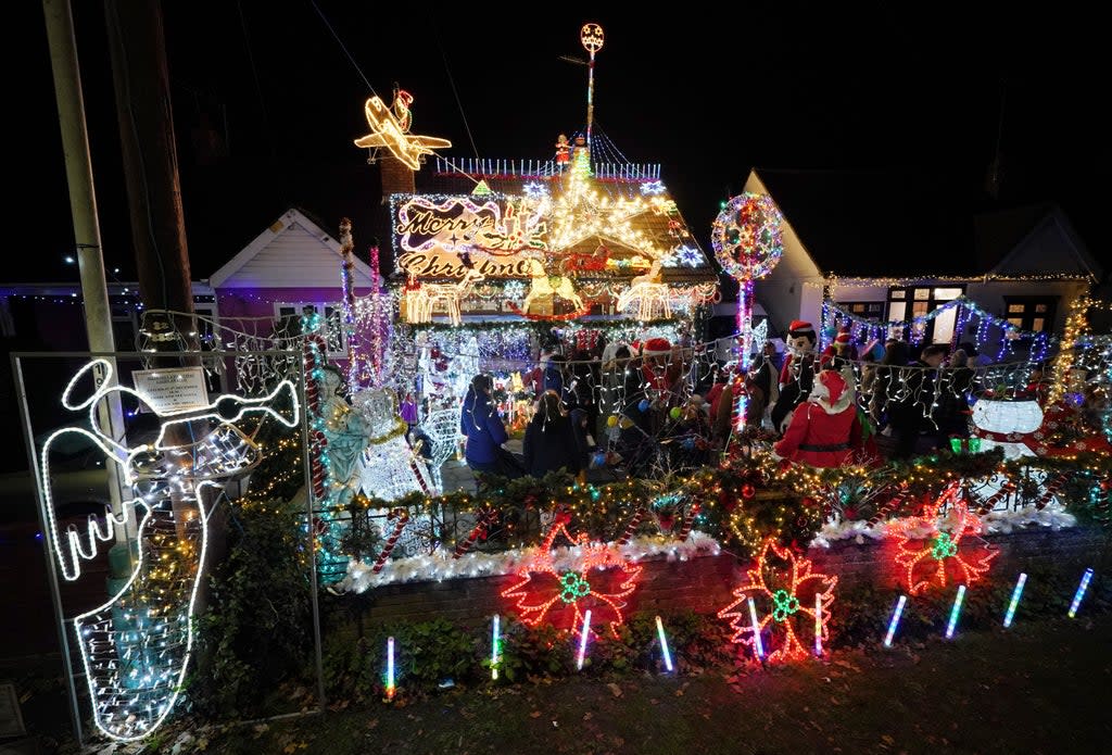 Peter Elliott and Lesley Haylett’s display of their Christmas lights (Jonathan Brady/PA) (PA Wire)