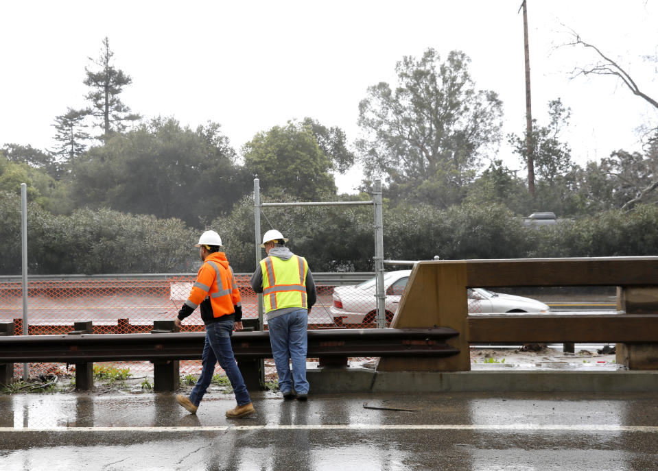 Two men inspect San Ysidro Creek as it flows steadily after heavy rain in Santa Barbara, Calif., Wednesday, March 6, 2019. A downpour rolled into California with spectacular lightning and thunderclaps Tuesday night in one of the most electric storm systems of the winter. The storm was the latest atmospheric river to flow into California this winter. The National Weather Service reported "copious" lightning strikes as the long plume of Pacific moisture approached the coast on Tuesday. (AP Photo/Daniel Dreifuss)