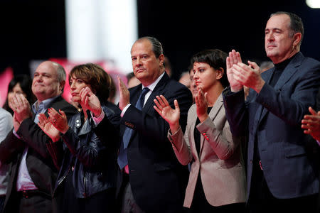 French Socialist Party First Secretary Jean-Christophe Cambadelis (C) gives Francois Hollande standing ovation during the convention of the Belle Alliance Populaire (Nice Popular Union), a gathering aiming at uniting democrats, socialists, ecologists, intellectuals, associative activists and trade unionists ahead of the 2017 French presidential election in Paris, France, December 3, 2016. REUTERS/Benoit Tessier