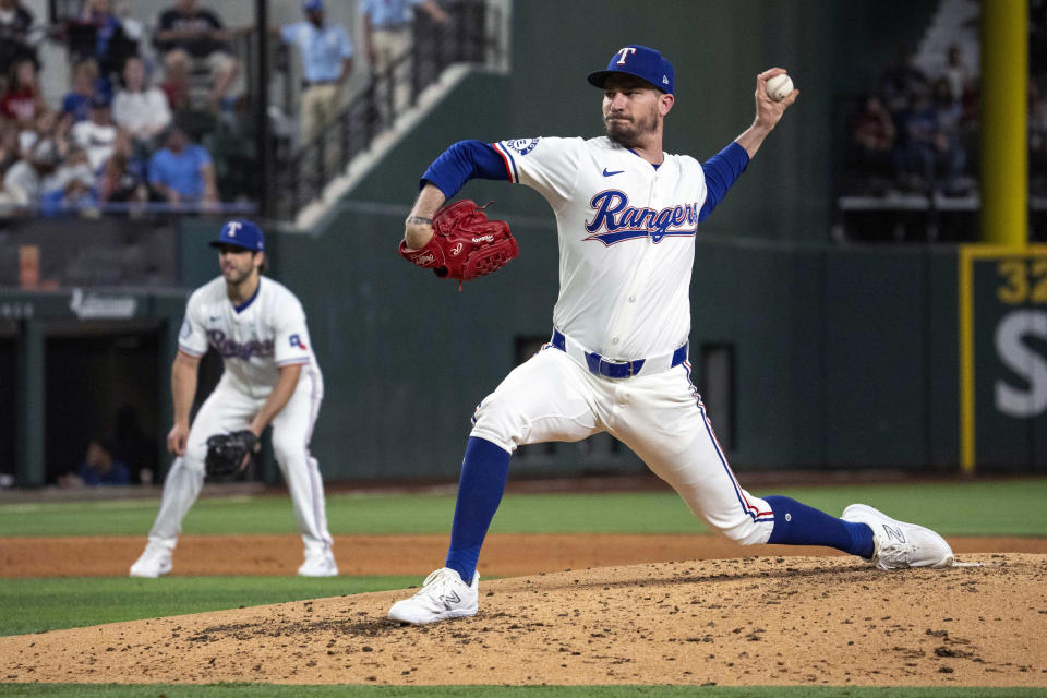 Texas Rangers relief pitcher Andrew Heaney works against the Arizona Diamondbacks during the fifth inning of a baseball game Tuesday, May 28, 2024, in Arlington, Texas. (AP Photo/Jeffrey McWhorter)