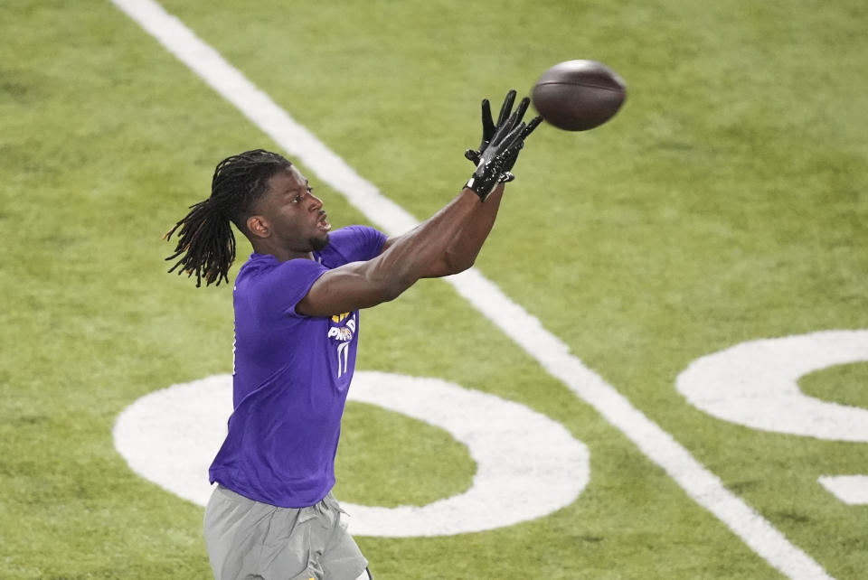 LSU wide receiver Brian Thomas Jr. catches a pass during LSU's NCAA football pro day in Baton Rouge, La., Wednesday, March 27, 2024. (AP Photo/Gerald Herbert)