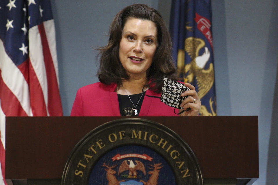 FILE - In this Thursday, May 21, 2020 file photo provided by the Michigan Office of the Governor, Michigan Gov. Gretchen Whitmer speeks during a news conference in Lansing, Mich. Gov. Whitmer on Friday, May 22, 2020, extended Michigan's stay-at-home order just over two additional weeks, through June 12, also keeping closed theaters, gyms and other places of public accommodation at least until that time. She also extended her emergency declaration through June 19. (Michigan Office of the Governor via AP, Pool) File