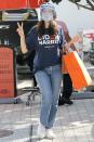 <p>Emmy Rossum dons a face shield, a mask and a tee in support of her candidate while out shopping in Beverly Hills Monday.</p>