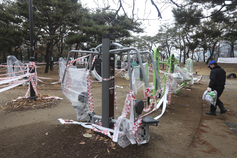 The use of public sports facilities is banned amid social distancing rules at a park in Goyang, South Korea, Friday, Jan. 22, 2021. South Korea is reporting its smallest daily increase in coronavirus infections in two months as officials express cautious hope that the country is beginning to wiggle out from its worst wave of the pandemic. (AP Photo/Ahn Young-joon)