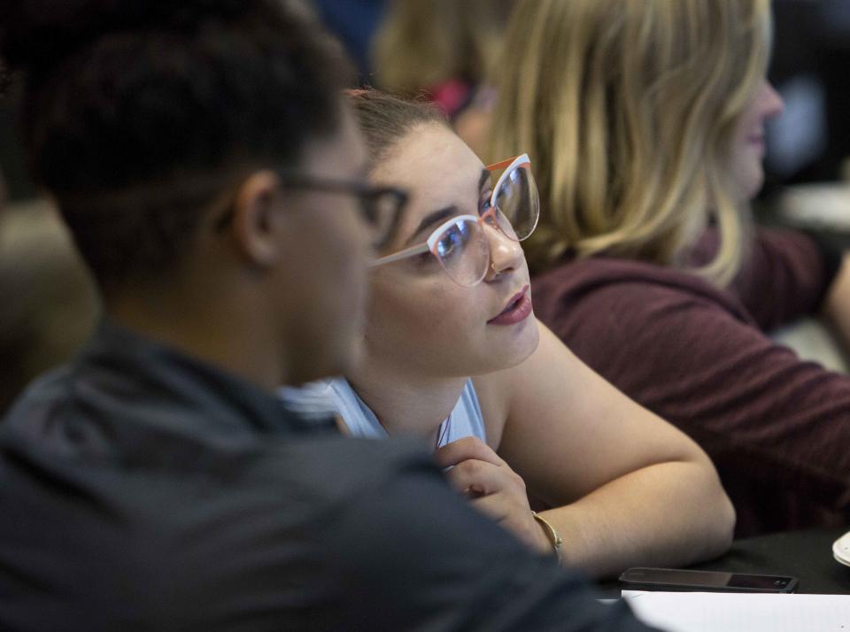 Maya Steinhart, a senior at C.K. McClatchy High School, listens to keynote speaker former U.S. Supreme Court Justice Anthony Kennedy during a luncheon held for high school civics students in Sacramento, Calif., on Friday, Sept. 28, 2018. Kennedy, who also attended C.K. McClatchy High School, declined to comment of the confirmation process of Judge Brett Kavanaugh. (AP Photo/Steve Yeater)