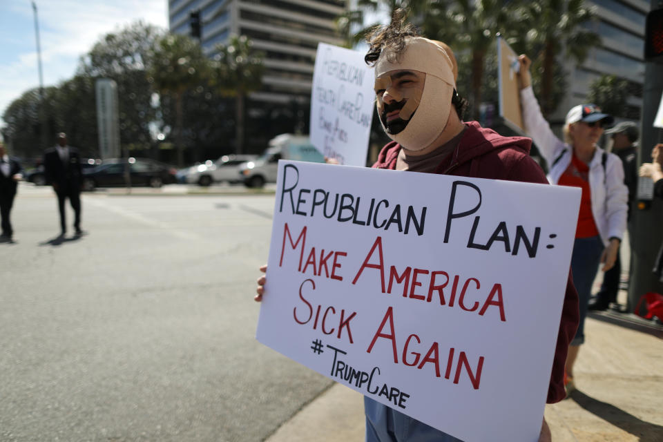 Rob Adler protests against President Trump’s proposed replacement for Obamacare in Los Angeles, California, U.S., March 14, 2017. REUTERS/Lucy Nicholson