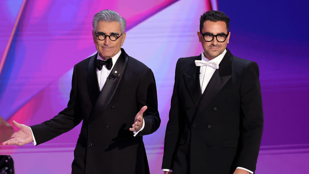 Hosts Eugene Levy and Dan Levy speak onstage during the 76th Primetime Emmy Awards at Peacock Theater 