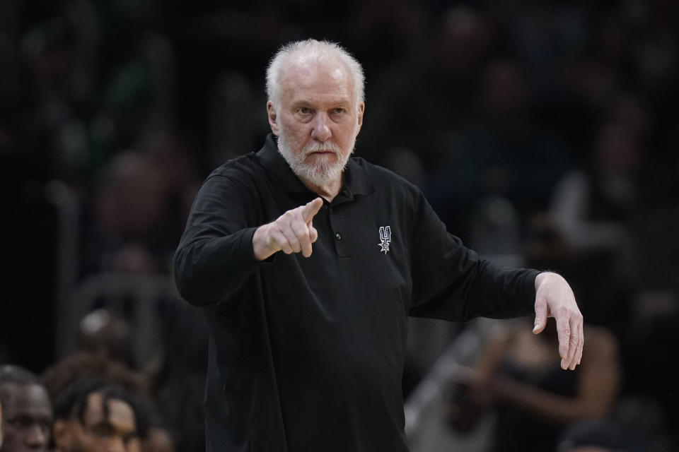 FILE - San Antonio Spurs head coach Gregg Popovich points from the bench in the second half of an NBA basketball game against the Boston Celtics, Sunday, March 26, 2023, in Boston. The Naismith Memorial Basketball Hall of Fame made it all official on Saturday, April 1, 2023 with three of the NBA’s all-time international greats — Dirk Nowitzki, Tony Parker and Pau Gasol — joining Dwyane Wade, Becky Hammon and Popovich as the headliners of the 2023 class that will be enshrined on Aug. 11 and 12 at ceremonies in Connecticut and Massachusetts.(AP Photo/Steven Senne, File)