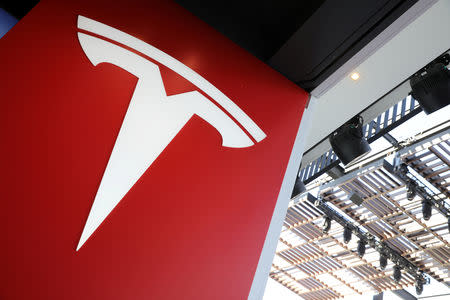 FILE PHOTO: A Tesla logo is seen in Los Angeles, California U.S. January 12, 2018. REUTERS/Lucy Nicholson/File Photo