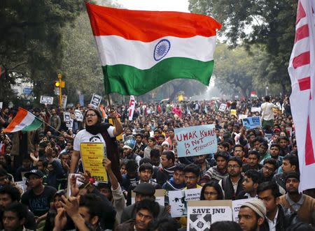 A demonstrator shouts slogans and waves the Indian national flag as she takes part in a protest demanding the release of Kanhaiya Kumar, a Jawaharlal Nehru University (JNU) student union leader accused of sedition, in New Delhi, India, February 18, 2016. REUTERS/Anindito Mukherjee