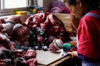 An employee makes Christmas products at Fuye toy factory following the coronavirus disease (COVID-19) outbreak in Yiwu