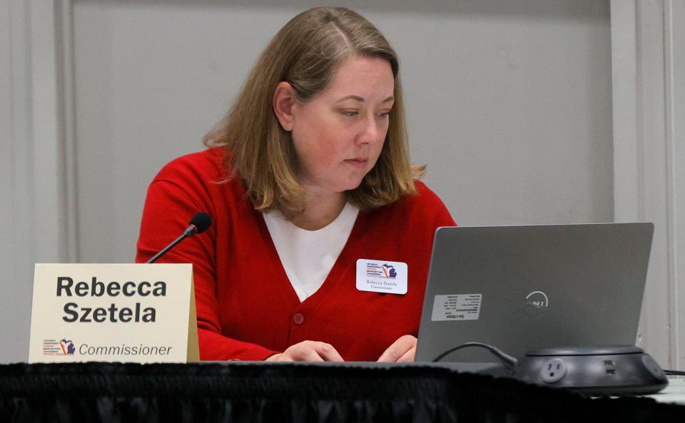 Rebecca Szetela of the Michigan Independent Citizens Redistricting Commission, looks over maps on her laptop during an independent redistricting commission meeting at Cadillac Place in Detroit on September 1, 2021. The commission met to work with mapping consultants on drawing lines for various voting districts in the state of Michigan.