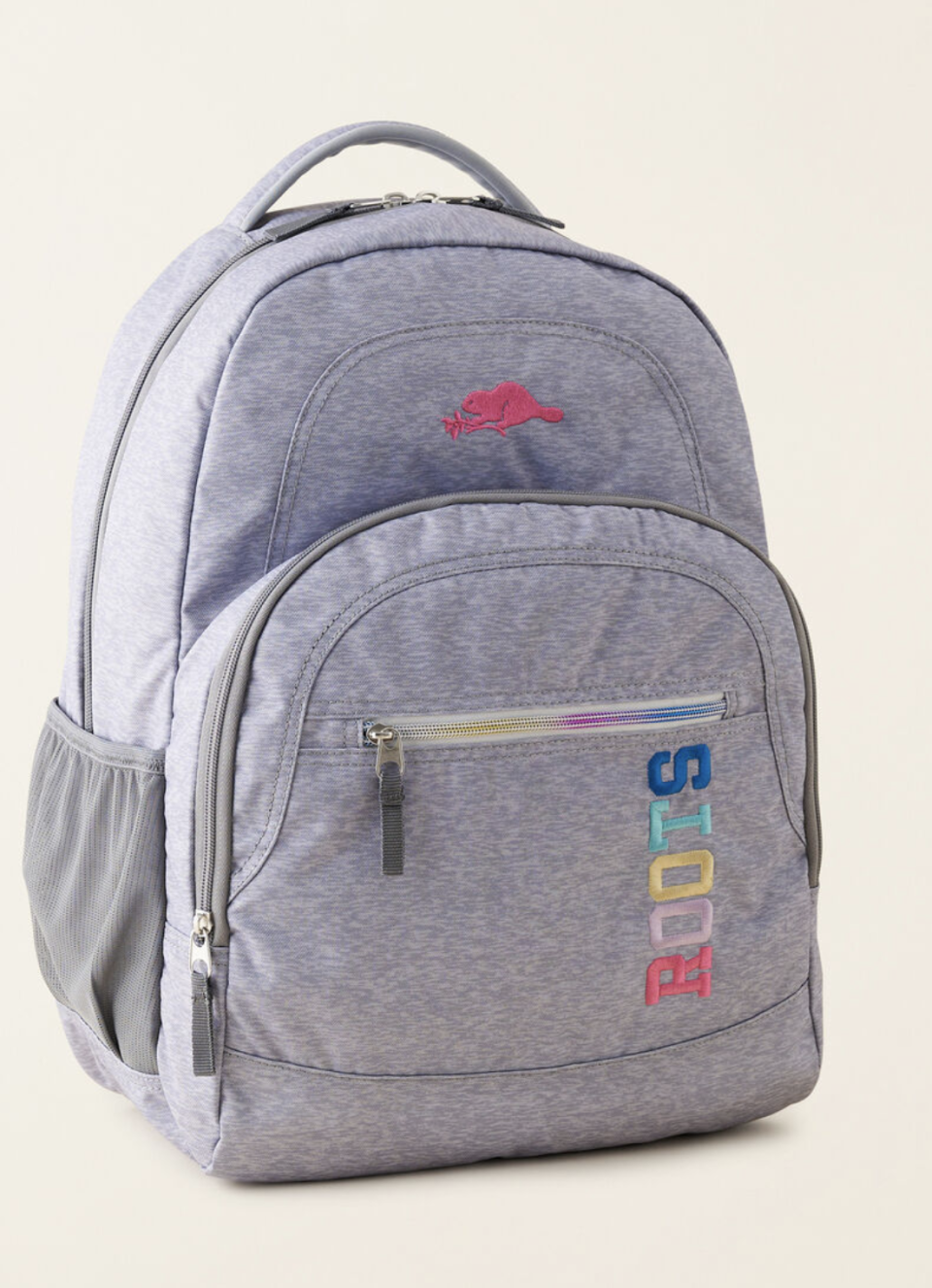 Kids Roots Backpack in light grey and purple with roots logo (photo via Roots)