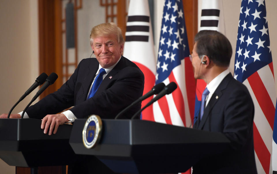 President Donald Trump smiles during a joint press conference with South Korea's President Moon Jae-in at the presidential Blue House in Seoul, South Korea.