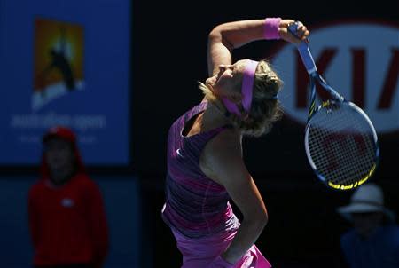 Victoria Azarenka of Belarus serves to Johanna Larsson of Sweden during their women's singles match at the Australian Open 2014 tennis tournament in Melbourne January 14, 2014. REUTERS/Petar Kujundzic