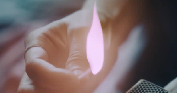 Taylor Swift lighting a match in the "Lavender Haze" video<p>YouTube</p>