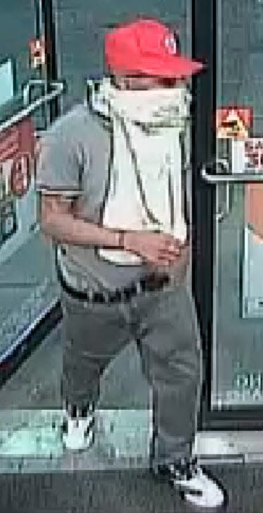 A man, wearing a red baseball cap with a "W," is suspected in a robbery at gunpoint on April 12 at the Circle K store, 10790 North Loop Drive in Socorro.