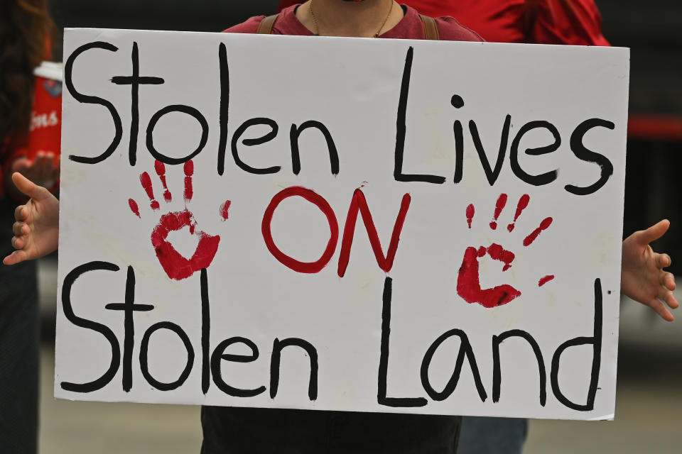 A participant holds a placard with words 'Stolen Lives On Stolen Land'.
Hundreds of women participated in the annual Red Dress Day march in downtown Edmonton, hosted by Project REDress, commemorating the lives of missing and murdered indigenous women and girls across Canada.
On Thursday, 5 May 2022, in Edmonton, Alberta, Canada. (Photo by Artur Widak/NurPhoto via Getty Images)