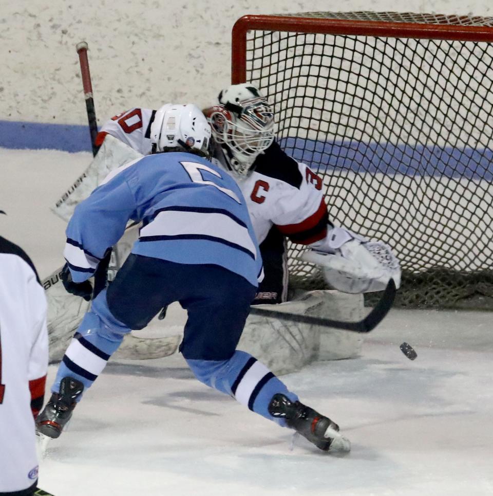 Will Crotty of Pelham scores on Rye's Anabelle Thomas  during a varsity hockey game against Rye at the Playland Ice Casino in Rye Jan. 19, 2022. Pelham defeated Rye 7-0.