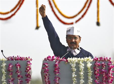 Arvind Kejriwal, leader of Aam Aadmi (Common Man) Party (AAP), shouts slogans after taking the oath as the new chief minister of Delhi during a swearing-in ceremony at Ramlila grounds in New Delhi December 28, 2013. REUTERS/Anindito Mukherjee