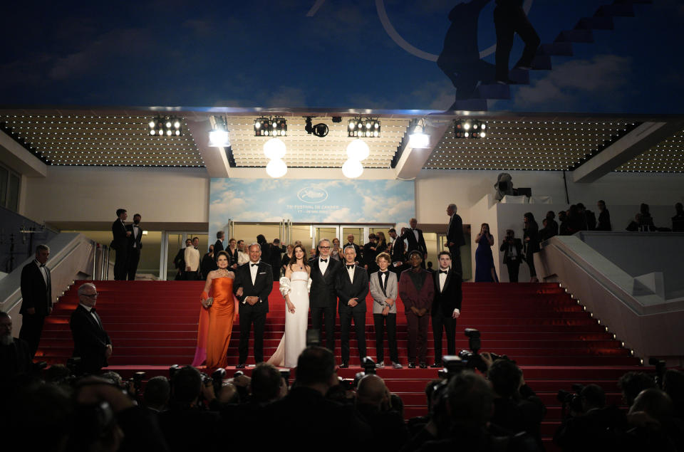 Tovah Feldshuh, left, Anne Hathaway, from third left, James Gray, Jeremy Strong, Michael Banks Repeta, Jaylin Webb, and Ryan Sell depart after the premiere of the film 'Armageddon Time' at the 75th international film festival, Cannes, southern France, Thursday, May 19, 2022. (AP Photo/Daniel Cole)