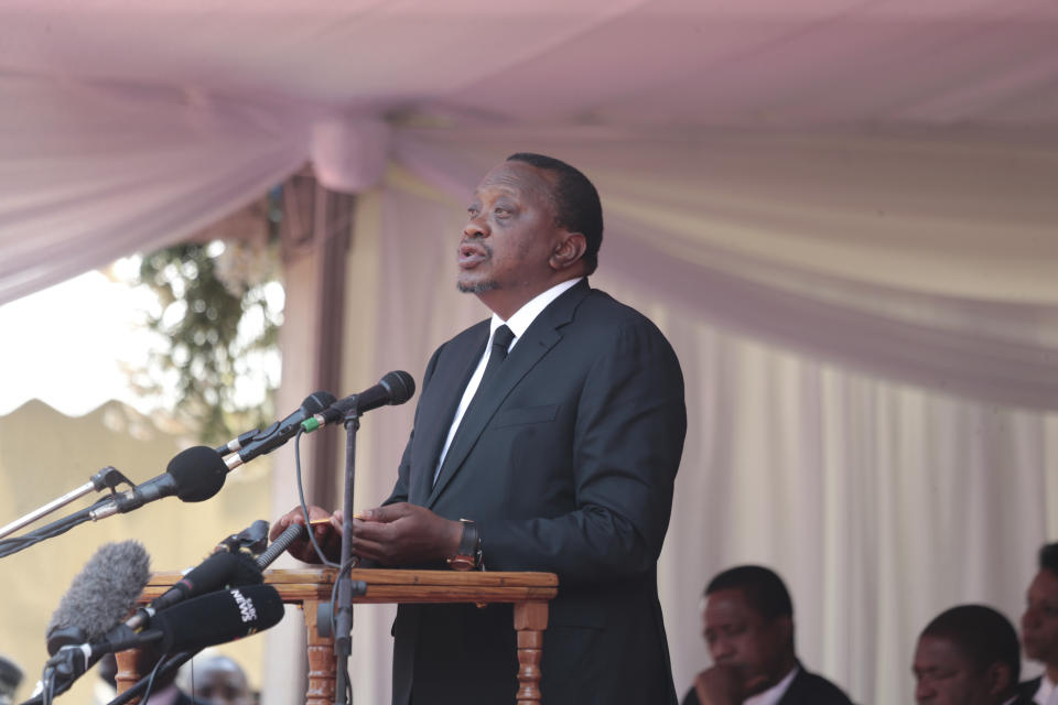 Kenyan President Uhuru Kenyatta delivers a speech during the funeral ceremony of the late former Zimbabwean leader, Robert Mugabe at the National Sports stadium in Harare, Saturday,Sept, 14, 2019. African heads of state and envoys are gathering to attend a state funeral for Mugabe, whose burial has been delayed for at least a month until a special mausoleum can be built for his remains. (AP Photo/Tsvangirayi Mukwazhi)