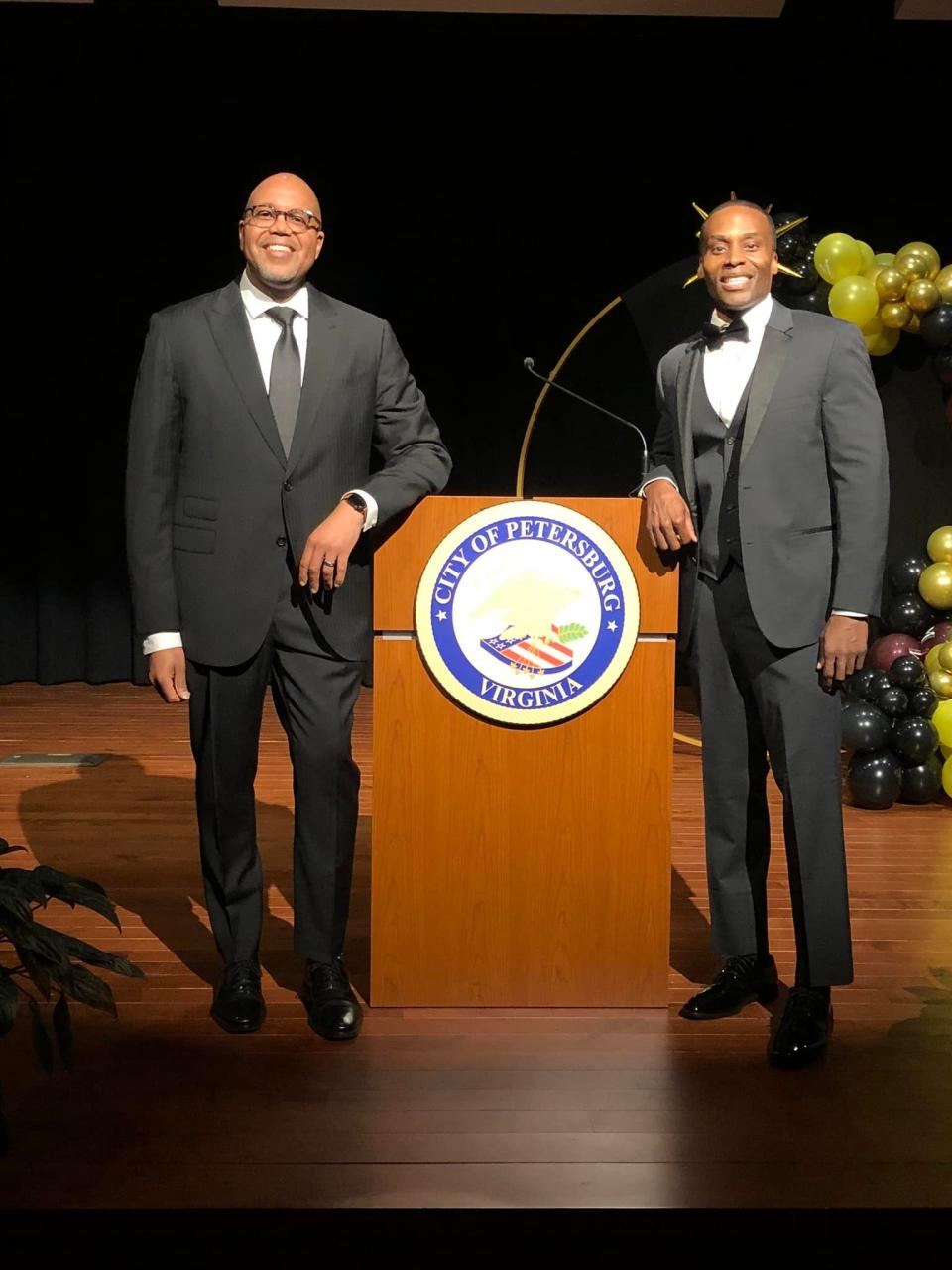 On the left, Petersburg Mayor Samuel Parham and Don "DB Donamatrix" Brooks strike poses at benefit gala in Petersburg, Va. on March 31, 2023.