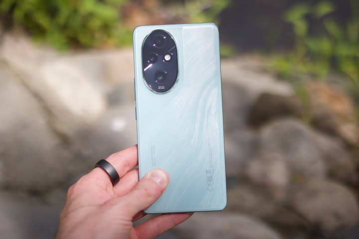 Someone holding the Honor 200 Pro, showing the back of the phone.