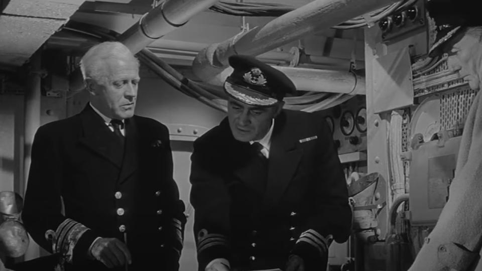 Naval officers talking to each other in Sink The Bismarck
