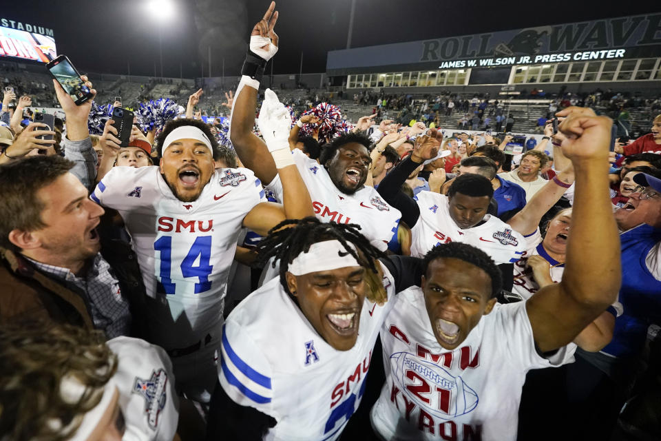 SMU celebrates after defeating Tulane in the American Athletic Conference championship NCAA college football game, Saturday, Dec. 2, 2023 in New Orleans. SMU won 26-14. (AP Photo/Gerald Herbert)