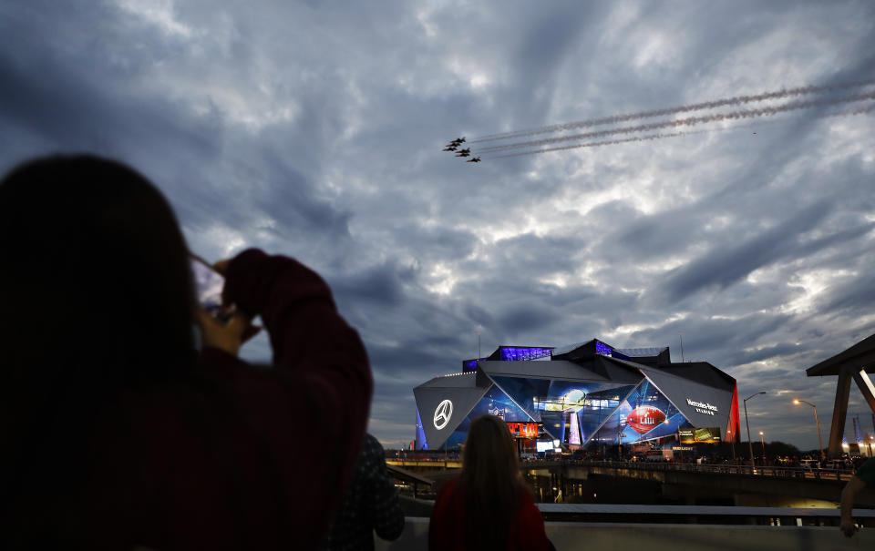 Jets perform a flyover of Mercedes-Benz Stadium ahead of Sunday's NFL Super Bowl 53 football game between the Los Angeles Rams and New England Patriots in Atlanta, Saturday, Feb. 2, 2019. (AP Photo/David Goldman)