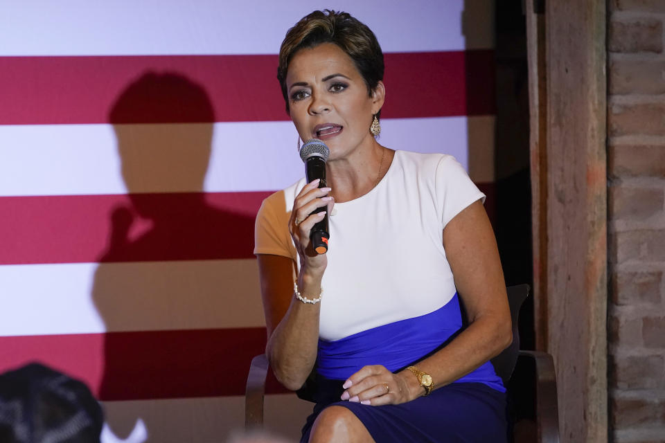 FILE - Arizona Republican gubernatorial candidate Kari Lake speaks at a rally, Sept. 20, 2022 in Chandler, Ariz. Presidential aspirants running for reelection to their current jobs while dreaming of the highest office in the land often face a dilemma during their campaigns. (AP Photo/Matt York)