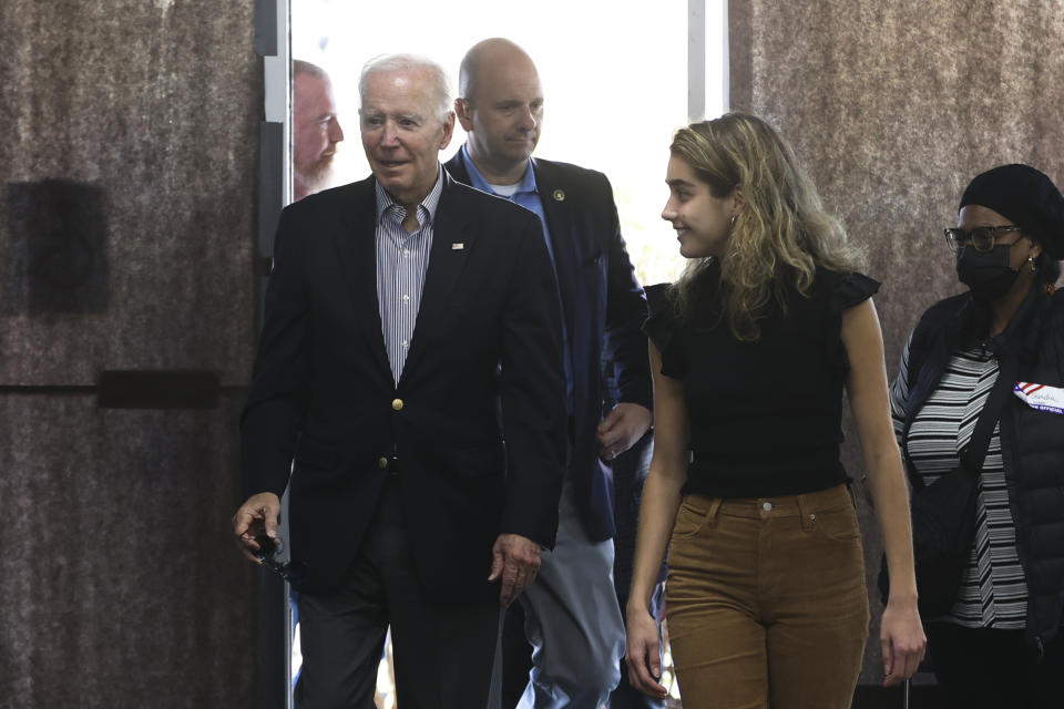 President Joe Biden arrives to cast his vote during early voting for the 2022 U.S. midterm elections with his granddaughter Natalie Biden, a first-time voter, at a polling station in Wilmington, Del., Saturday, Oct. 29, 2022. (Tasos Katopodis/Pool Photo via AP)