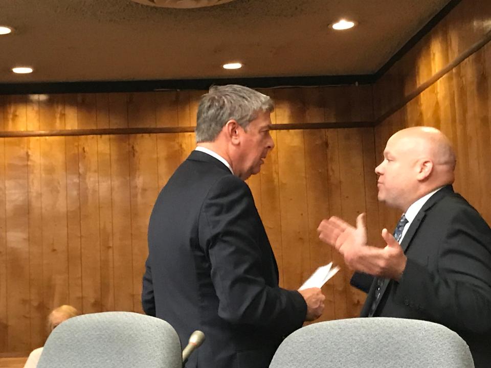 Shawn Kelly ( R ) conferring with his new attorney, Patrick Jennings on Monday.