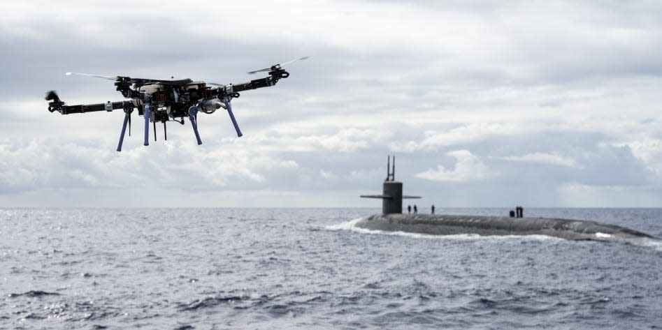 An unmanned aerial vehicle delivers a payload to the Ohio-class ballistic-missile submarine USS Henry M. Jackson (SSBN 730) around the Hawaiian Islands