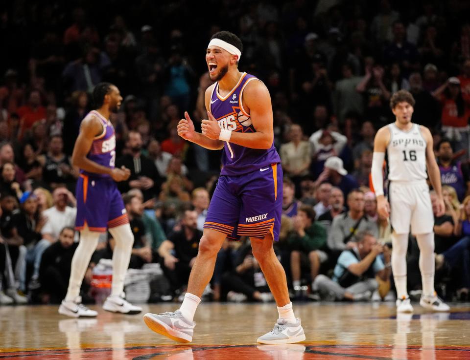 Suns guard Devin Booker (1) reacts after making a three-pointer against the Spurs during the second half at Footprint Center in Phoenix on Nov. 2, 2023.