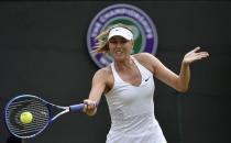 Maria Sharapova of Russia hits a shot during her match against Irina-Camelia Begu of Romania at the Wimbledon Tennis Championships in London, July 3, 2015. REUTERS/Toby Melville