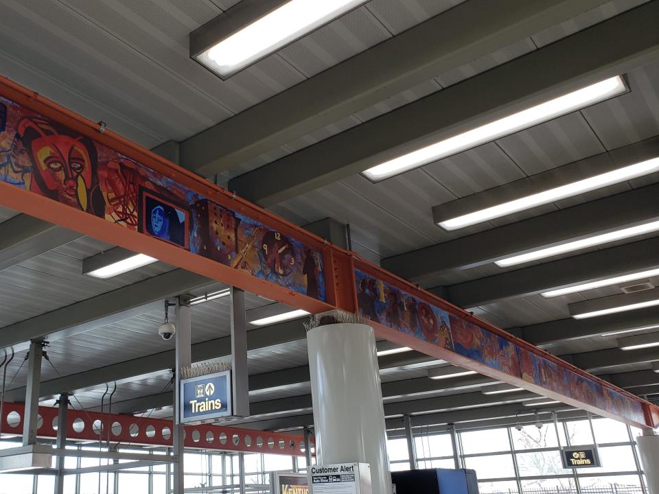 signs pointing toward orange line stop at midway airport