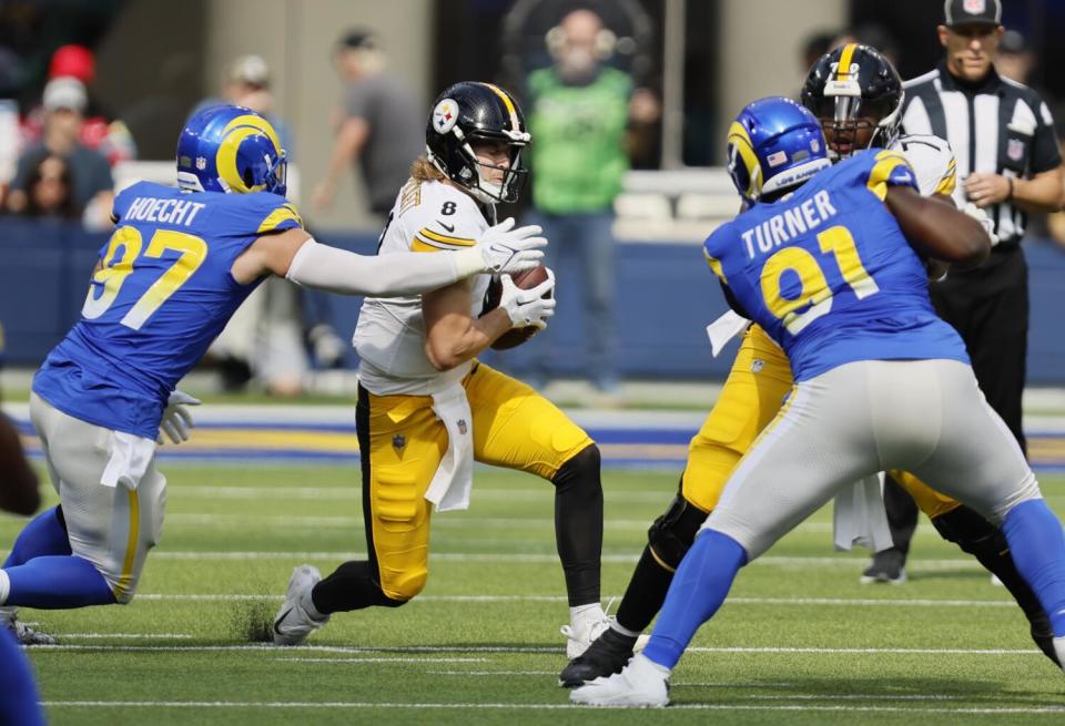 The Rams' Michael Hoecht (97) tackles Steelers quarterback Kenny Pickett.