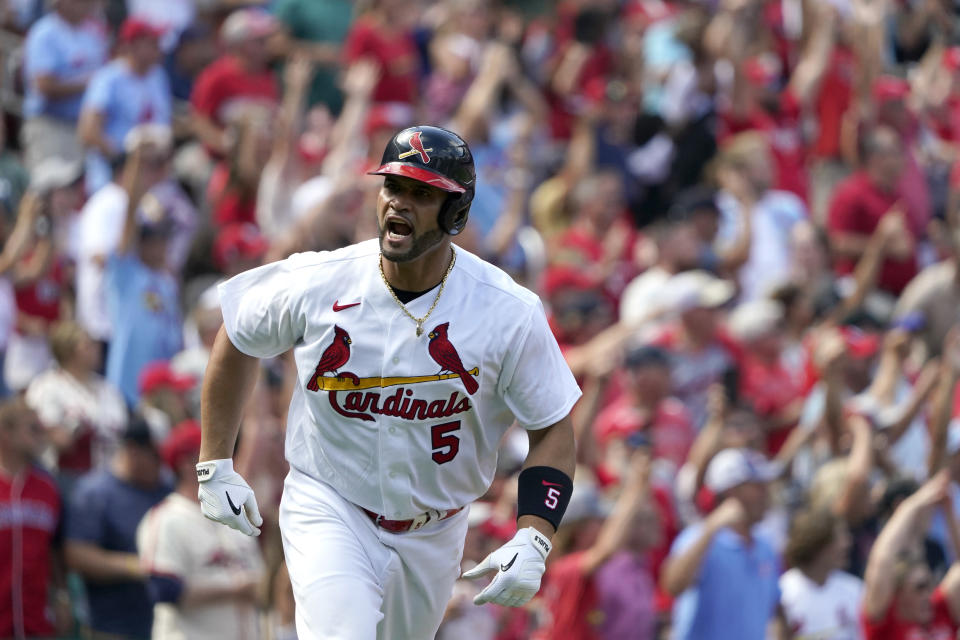 St. Louis Cardinals' Albert Pujols celebrates after hitting a three-run home run during the eighth inning of a baseball game against the Milwaukee Brewers Sunday, Aug. 14, 2022, in St. Louis. (AP Photo/Jeff Roberson)