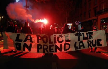 Demonstrators hold a banner during a rally in Marseille, October 31, 2014. REUTERS/Jean-Paul Pelissier