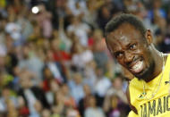 Atletismo - Campeonato Mundial de Atletismo - Final Posta Masculina 4x100 Metros - Estadio de Londres, Londres, Reino Unido – 12 de agosto, 2017. Usain Bolt de Jamaica reacciona después de sufrir una lesión. REUTERS/Kai Pfaffenbach