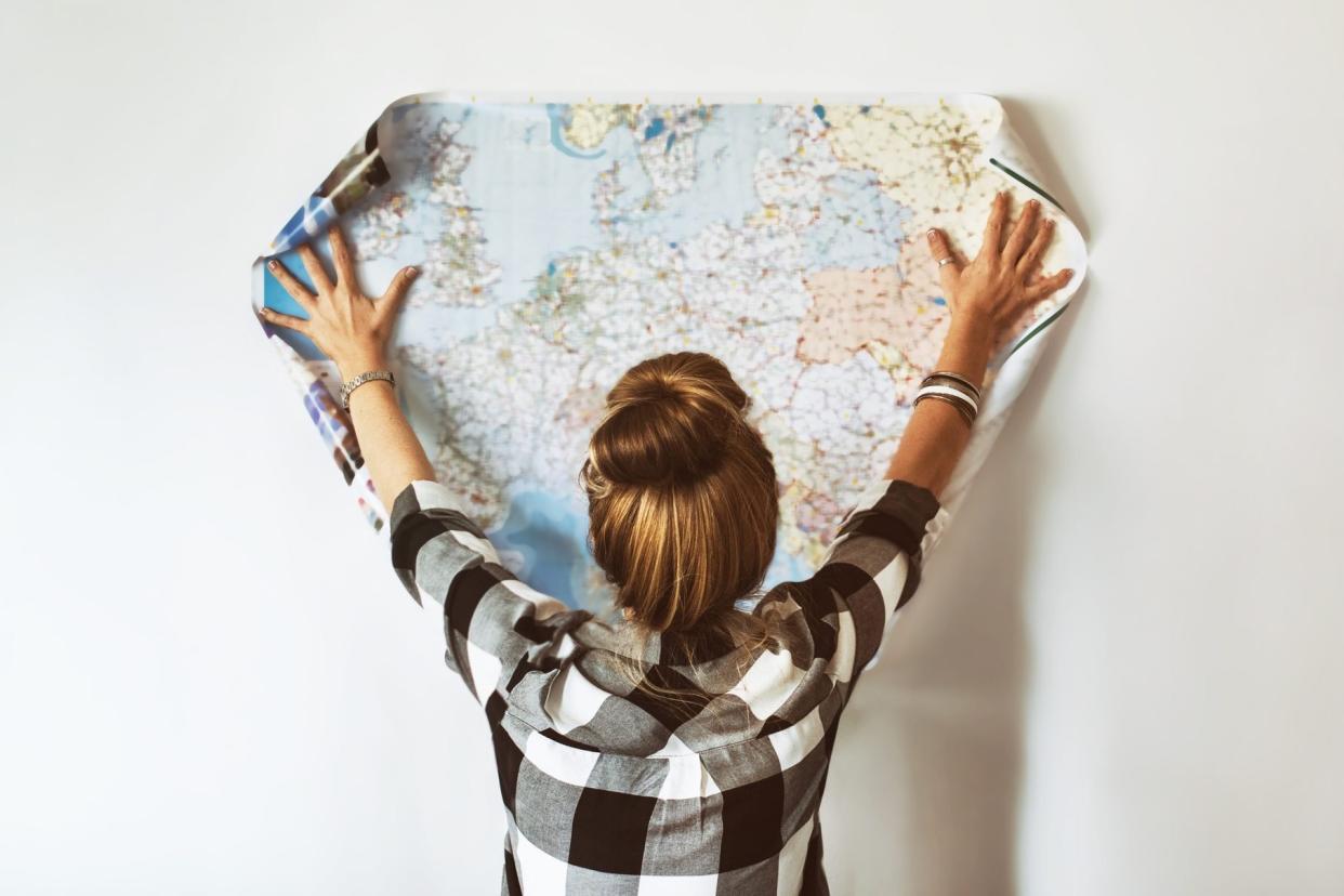 Young woman looking at map