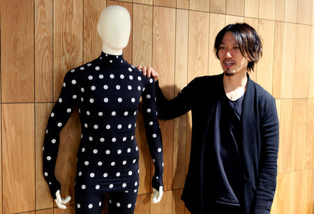 FILE PHOTO: Yuki Kanayama, Chief Innovation Officer of Zozo Technologies, poses with a Zozosuit after an interview with Reuters in Tokyo, Japan, March 20, 2019. REUTERS/Sam Nussey/File photo